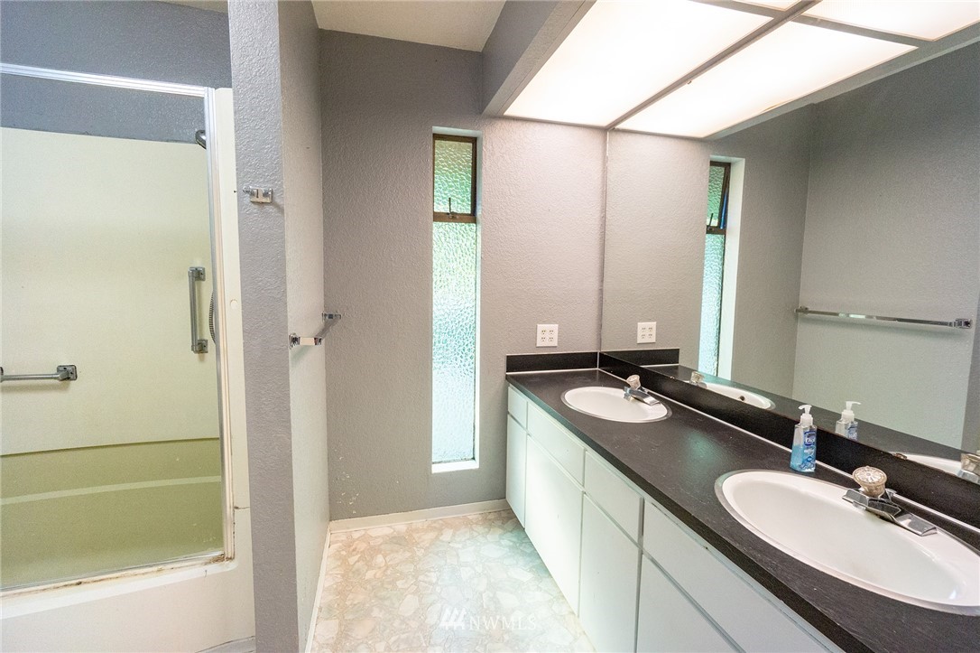 6618 Willow Road Everett, WA 98203 - Photo 8 of 15 a bathroom with a granite countertop sink and a mirror