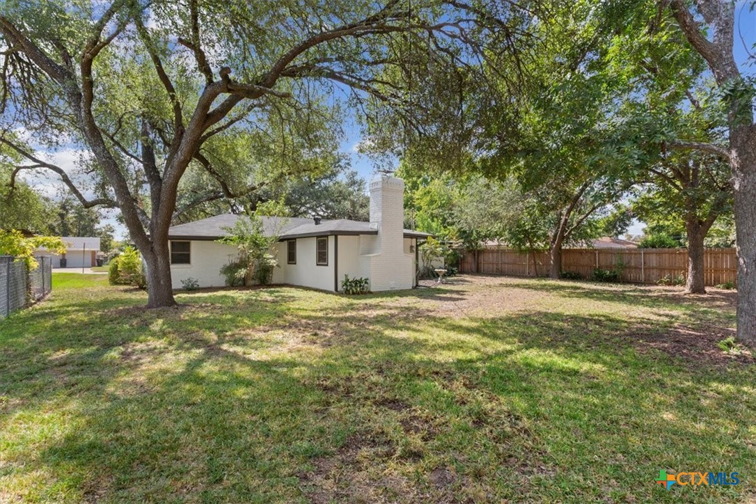 4412 Briar Cliff Road Temple, TX 76502 - Photo 27 of 28 a view of a yard with a house and large trees