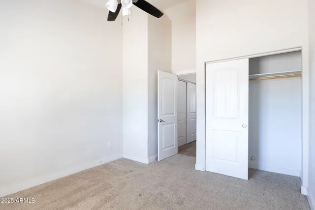 a view of small space with wooden floor and a window
