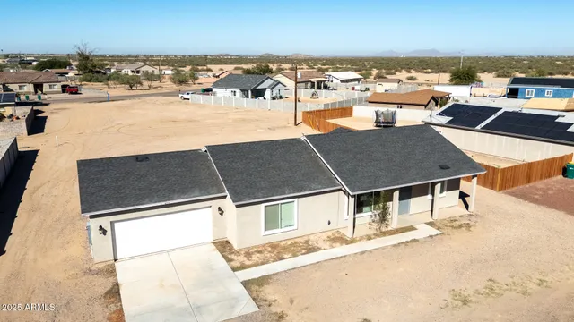 an aerial view of a house with swimming pool
