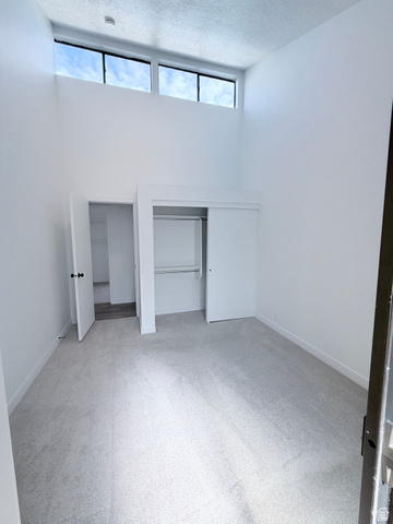 227 South West Lane Provo, UT 84601 - Photo 14 of 25 Interior room with vaulted ceilings and high-level windows