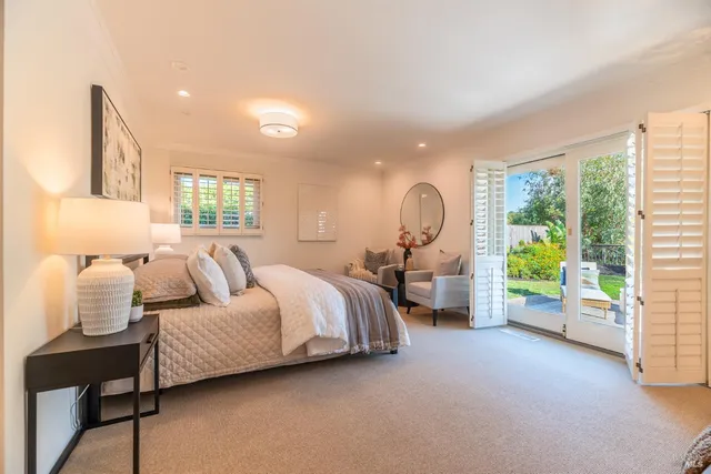 a bed room with a bed and a chandelier