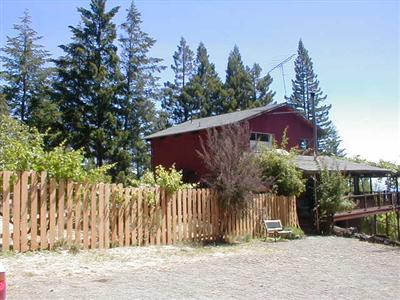 35840 Tan Bark Road Gualala, CA 95445 - Photo 4 of 7 a view of a house with a yard