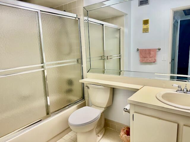 18730 Stewart Circle, Unit 5 Boca Raton, FL 33496 - Photo 8 of 24 a bathroom with a sink toilet and shower