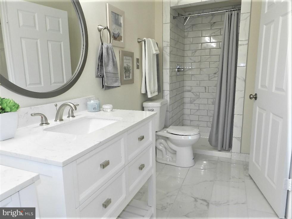 213 Beaumont Road Silver Spring, MD 20904 - Photo 21 of 39 Primary bath 12X24 Carrara floors