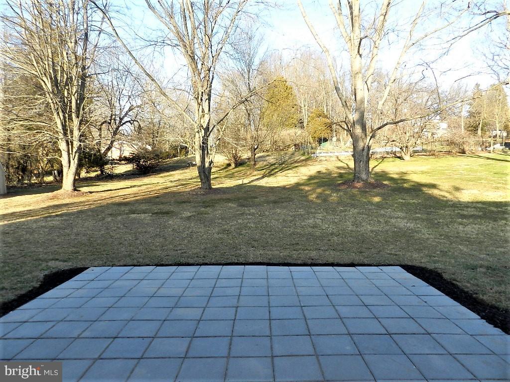 213 Beaumont Road Silver Spring, MD 20904 - Photo 33 of 39 Rear paver patio overlooks 1/2 acre private lot