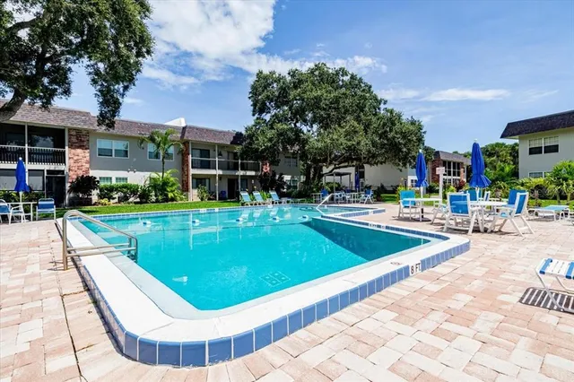 a view of a swimming pool with a patio