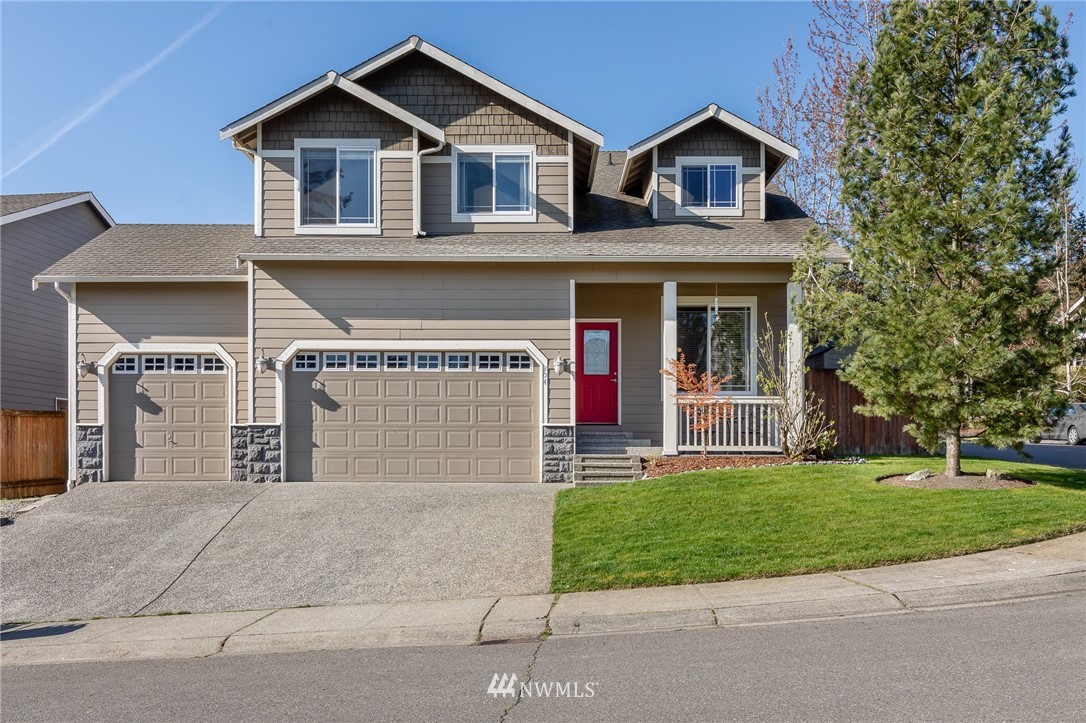 204 203rd Street Southeast Bothell, WA 98012 - Photo 1 of 25 a front view of a house with a yard and garage