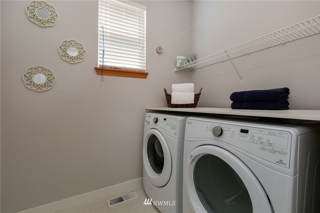 204 203rd Street Southeast Bothell, WA 98012 - Photo 11 of 25 a view of storage and utility room with washer and dryer