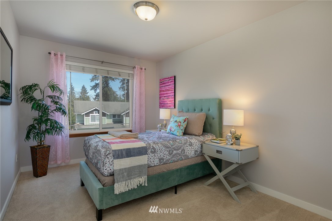 204 203rd Street Southeast Bothell, WA 98012 - Photo 20 of 25 a bedroom with a bed and a potted plant