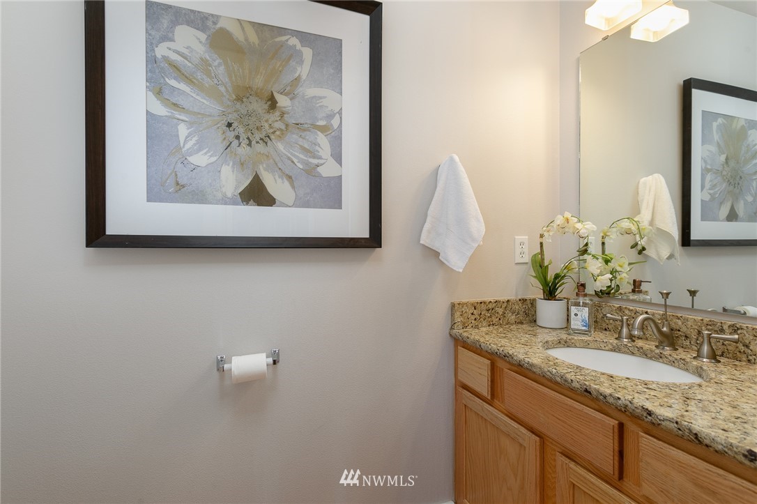 204 203rd Street Southeast Bothell, WA 98012 - Photo 10 of 25 a bathroom with a sink and mirror
