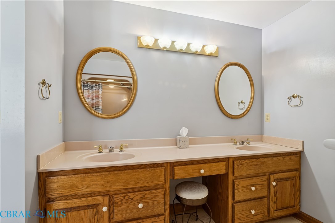 6253 Ark Road Gloucester, VA 23061 - Photo 27 of 38 Full bath with double vanity and a shower with curtain