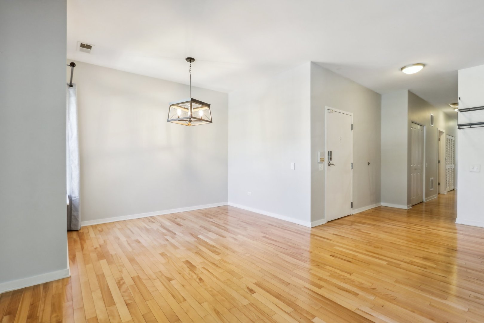 1033 South Lytle Street, Unit 201 Chicago, IL 60607 - Photo 5 of 35 a view of a room with wooden floor and windows