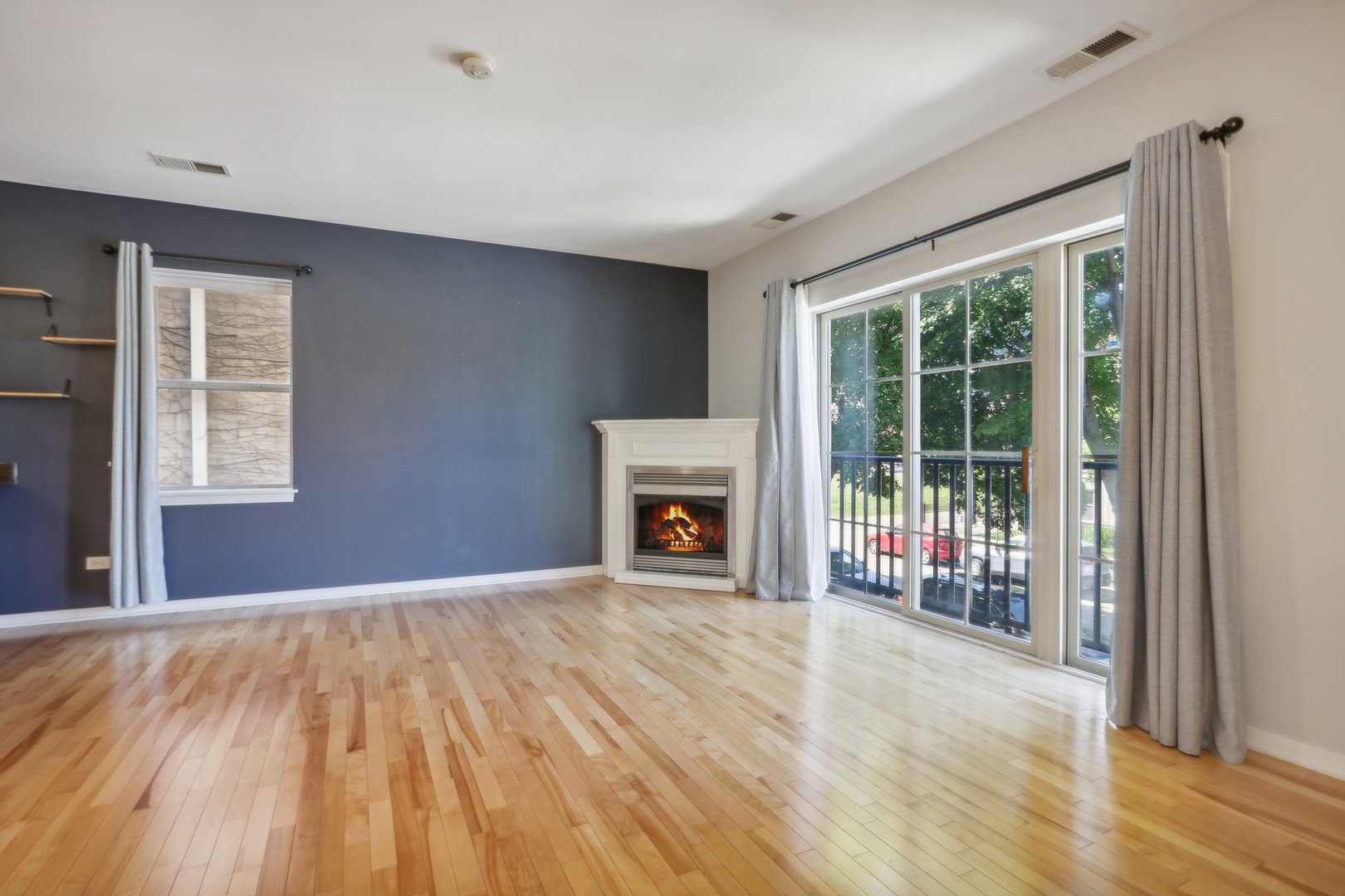 1033 South Lytle Street, Unit 201 Chicago, IL 60607 - Photo 8 of 35 a view of an empty room with wooden floor and a window