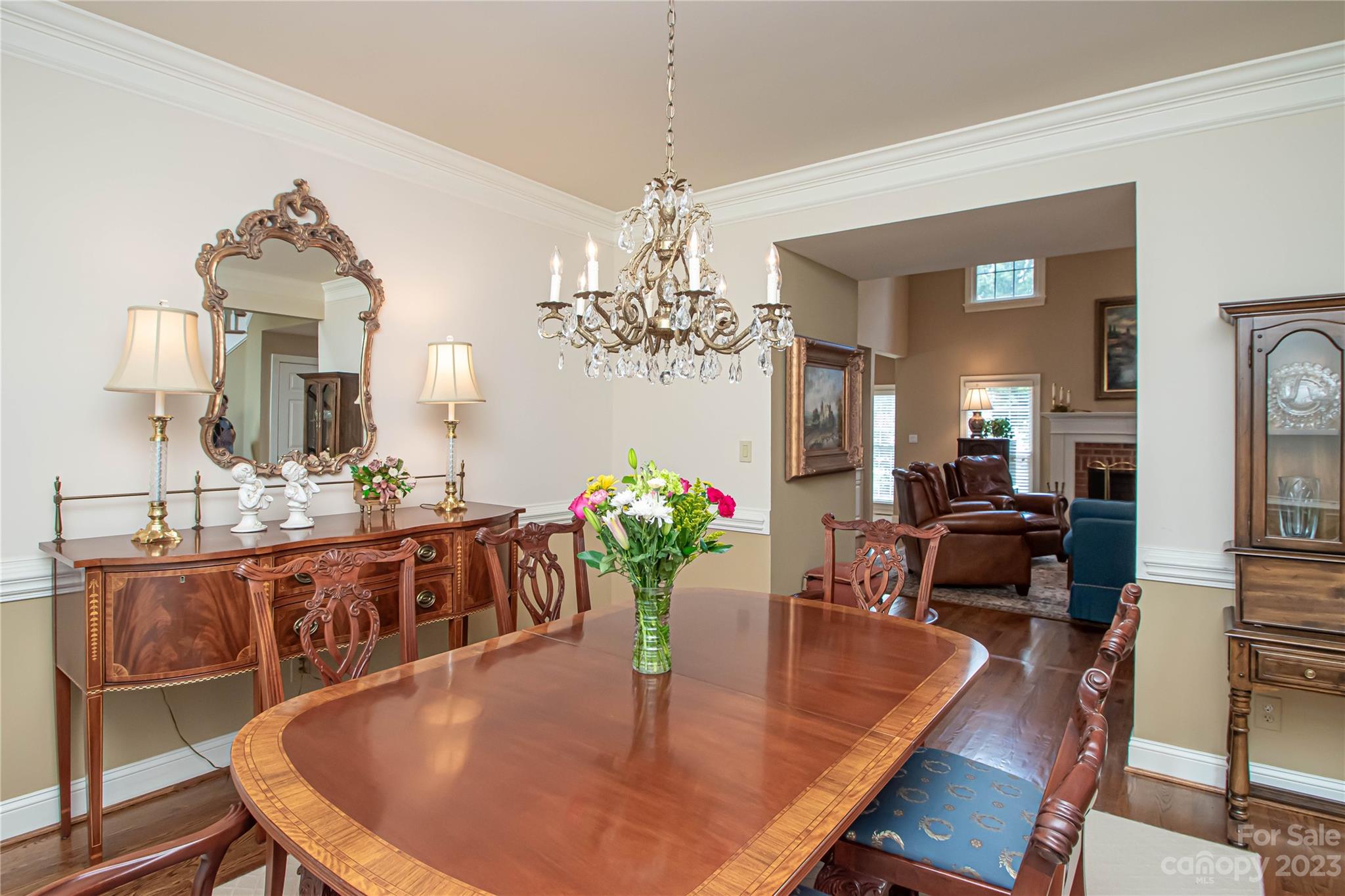 2100 Peterborough Lane Charlotte, NC 28270 - Photo 11 of 48 a view of a dining room with furniture a chandelier and wooden floor