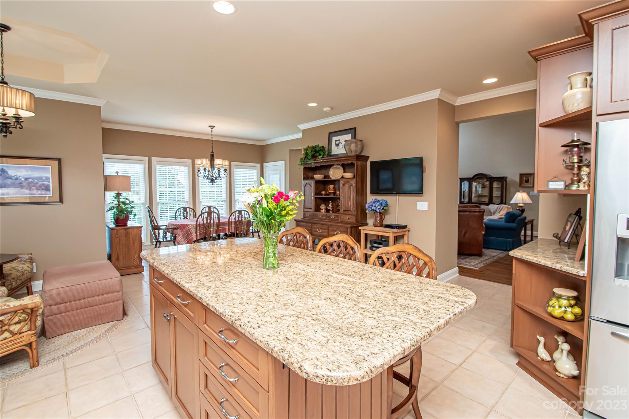 2100 Peterborough Lane Charlotte, NC 28270 - Photo 16 of 48 a living room with stainless steel appliances kitchen island granite countertop furniture and a kitchen view