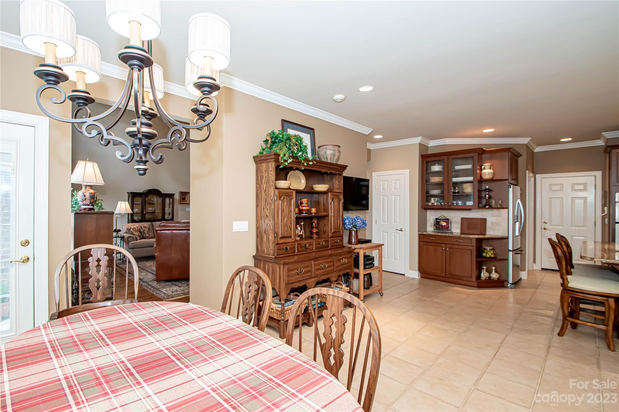 2100 Peterborough Lane Charlotte, NC 28270 - Photo 18 of 48 a room with lots of white furniture and chandelier
