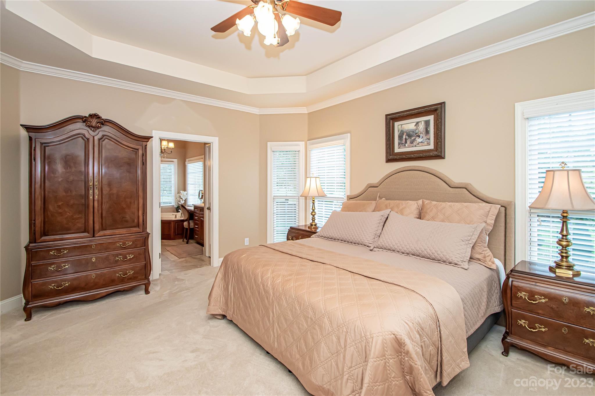 2100 Peterborough Lane Charlotte, NC 28270 - Photo 26 of 48 a bedroom with a bed and a chandelier
