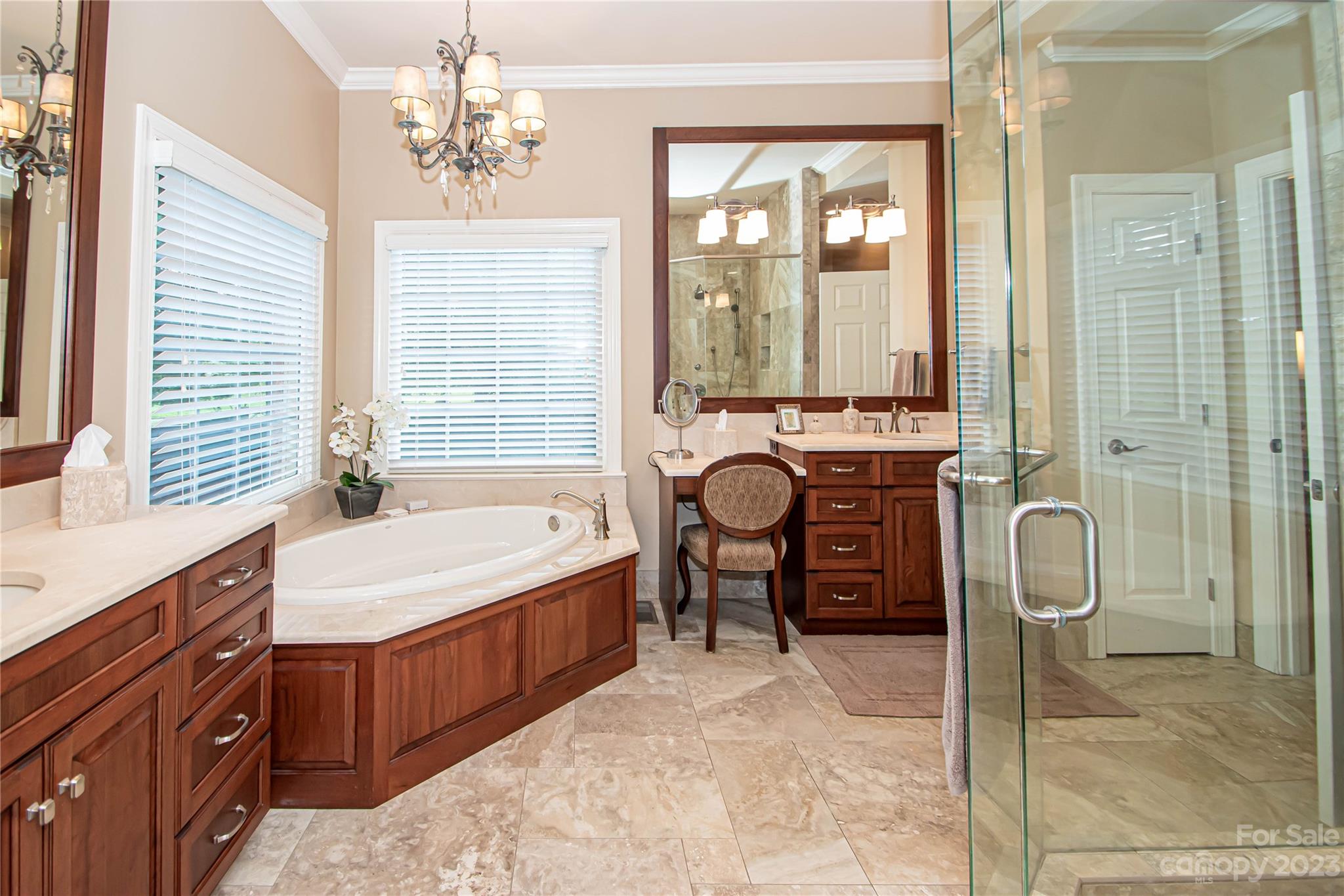 2100 Peterborough Lane Charlotte, NC 28270 - Photo 29 of 48 a spacious bathroom with a tub sink and mirror