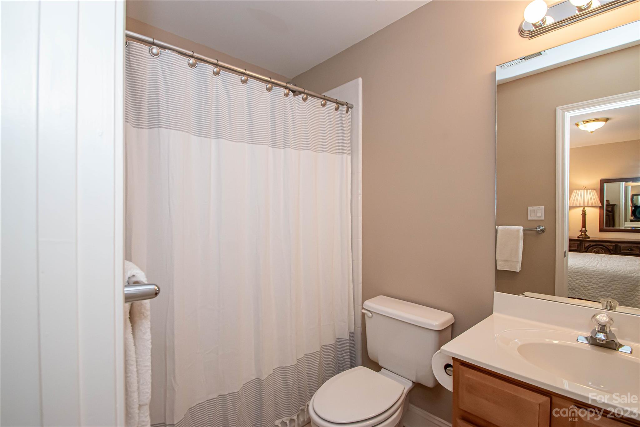 2100 Peterborough Lane Charlotte, NC 28270 - Photo 32 of 48 a white toilet sitting next to a bathroom sink