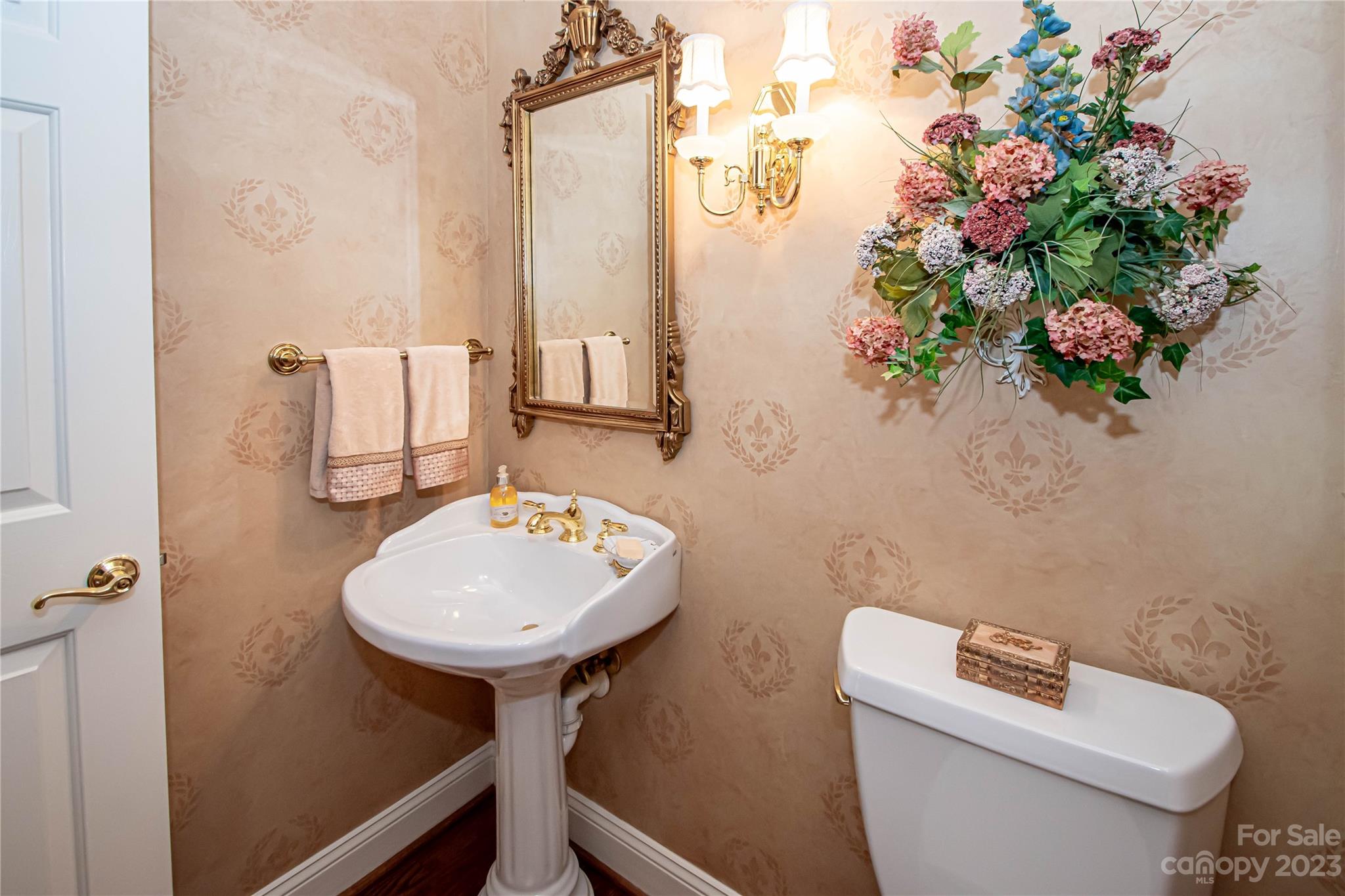 2100 Peterborough Lane Charlotte, NC 28270 - Photo 33 of 48 a bathroom with a toilet sink and mirror