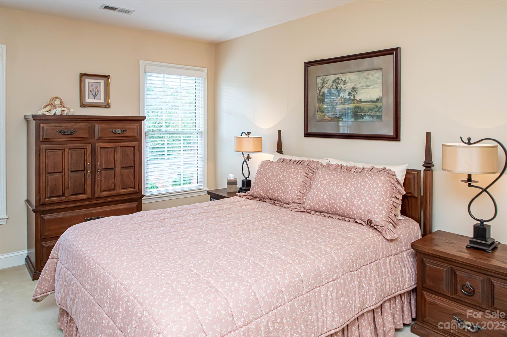 2100 Peterborough Lane Charlotte, NC 28270 - Photo 34 of 48 a bedroom with a bed and a dresser