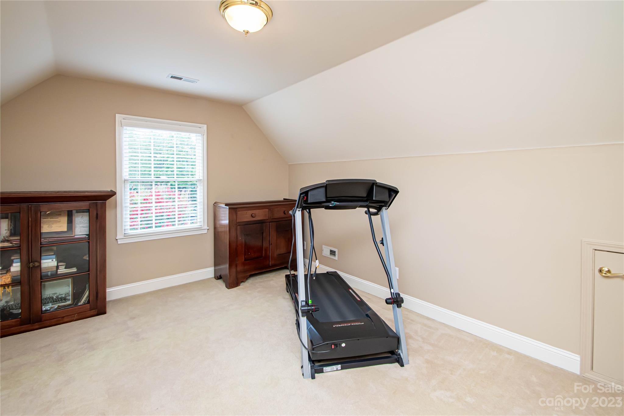 2100 Peterborough Lane Charlotte, NC 28270 - Photo 39 of 48 a room with gym equipment and a window