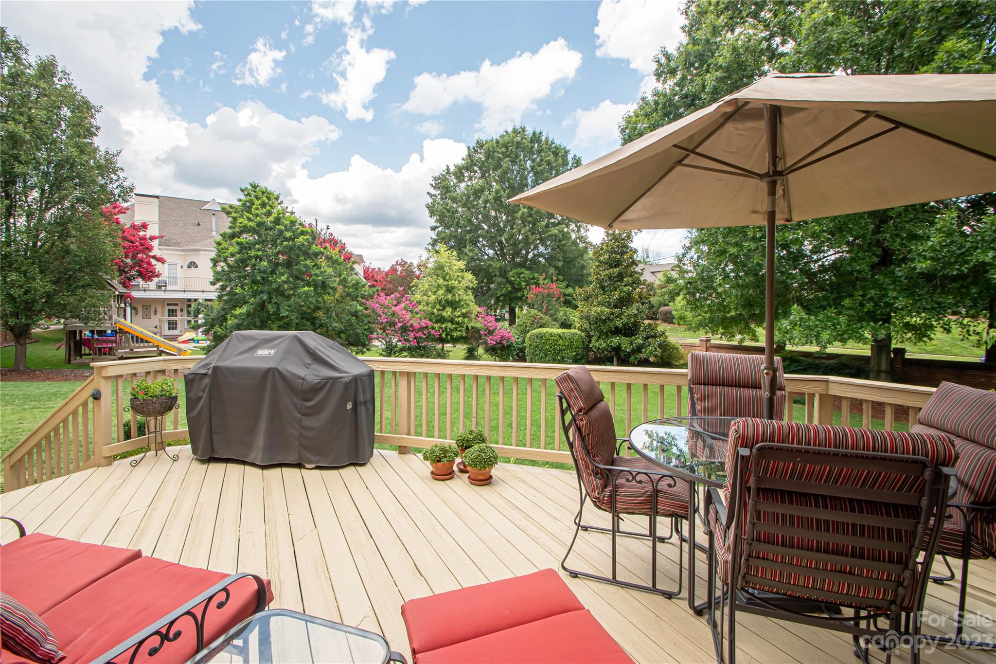 2100 Peterborough Lane Charlotte, NC 28270 - Photo 41 of 48 a view of table and chairs under an umbrella