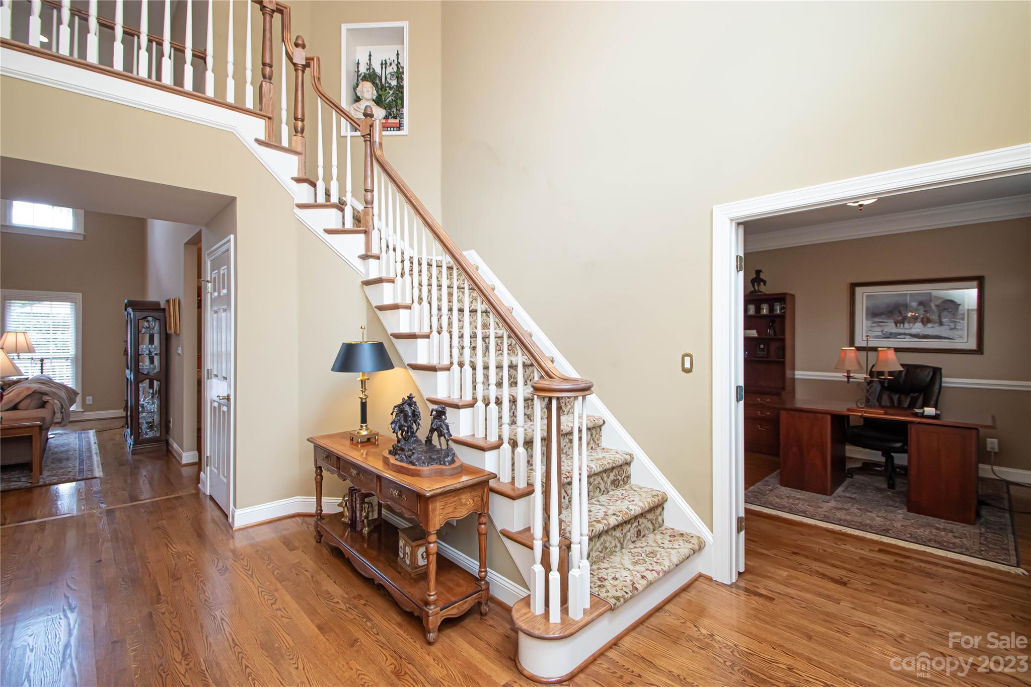 2100 Peterborough Lane Charlotte, NC 28270 - Photo 8 of 48 a view of entryway dining room and hall with wooden floor