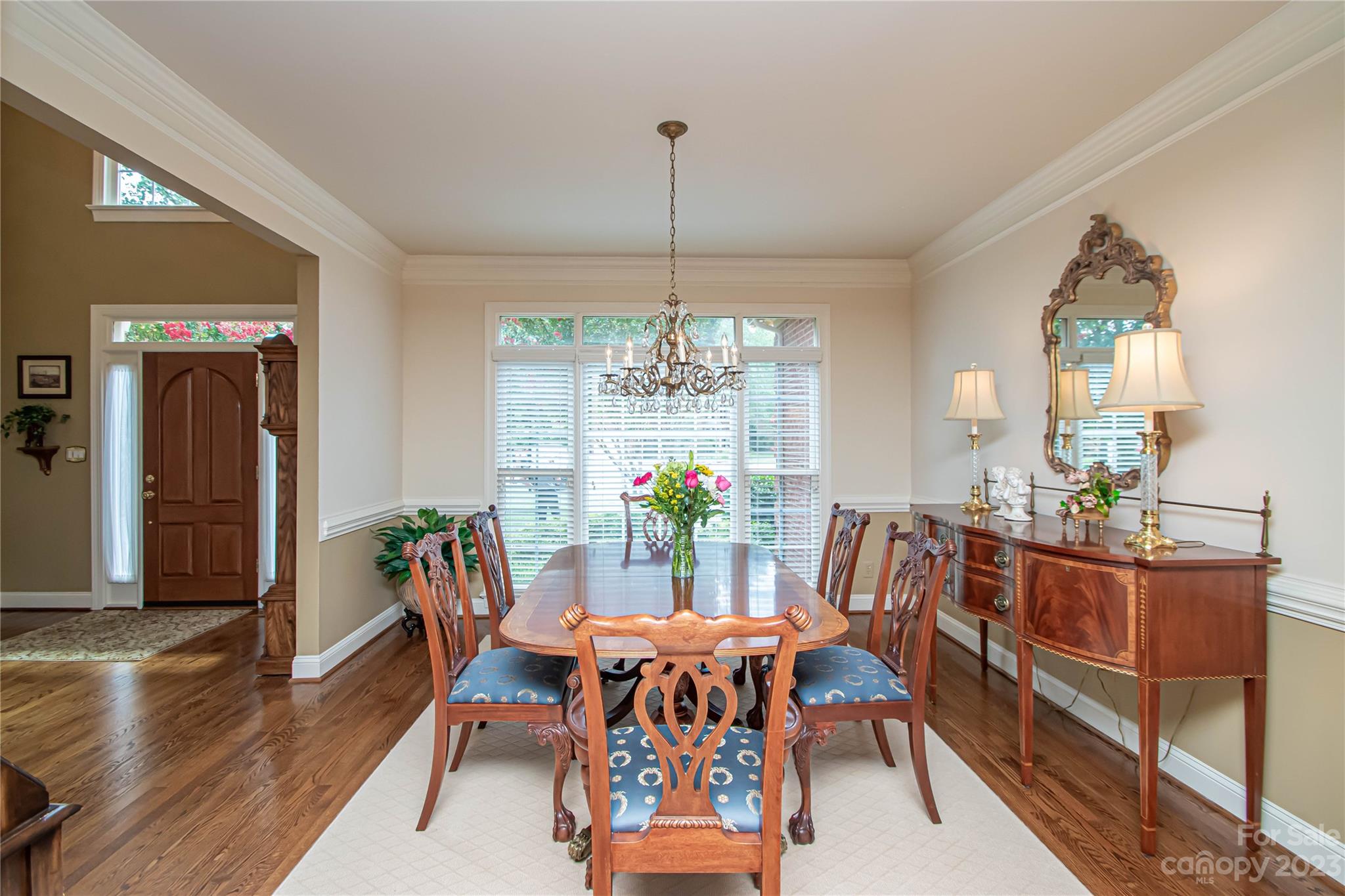 2100 Peterborough Lane Charlotte, NC 28270 - Photo 9 of 48 a dining room with furniture a chandelier and wooden floor