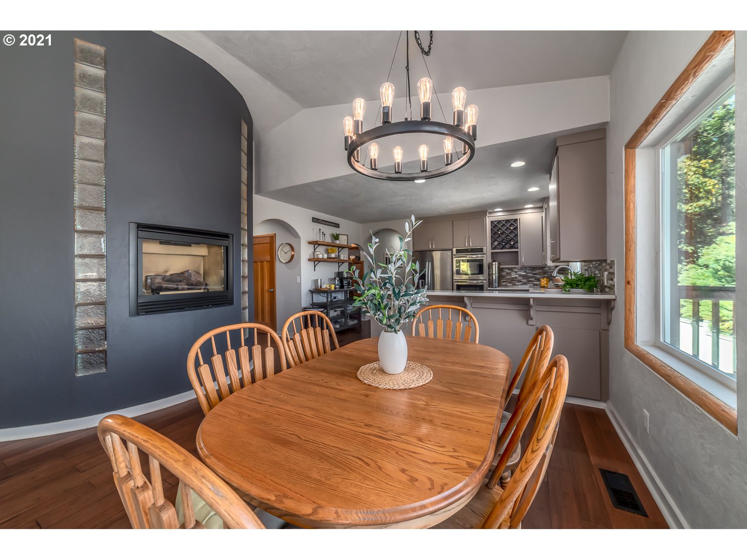 1164 South 68th Street Springfield, OR 97478 - Photo 10 of 32 a view of a dining room with furniture wooden floor and chandelier