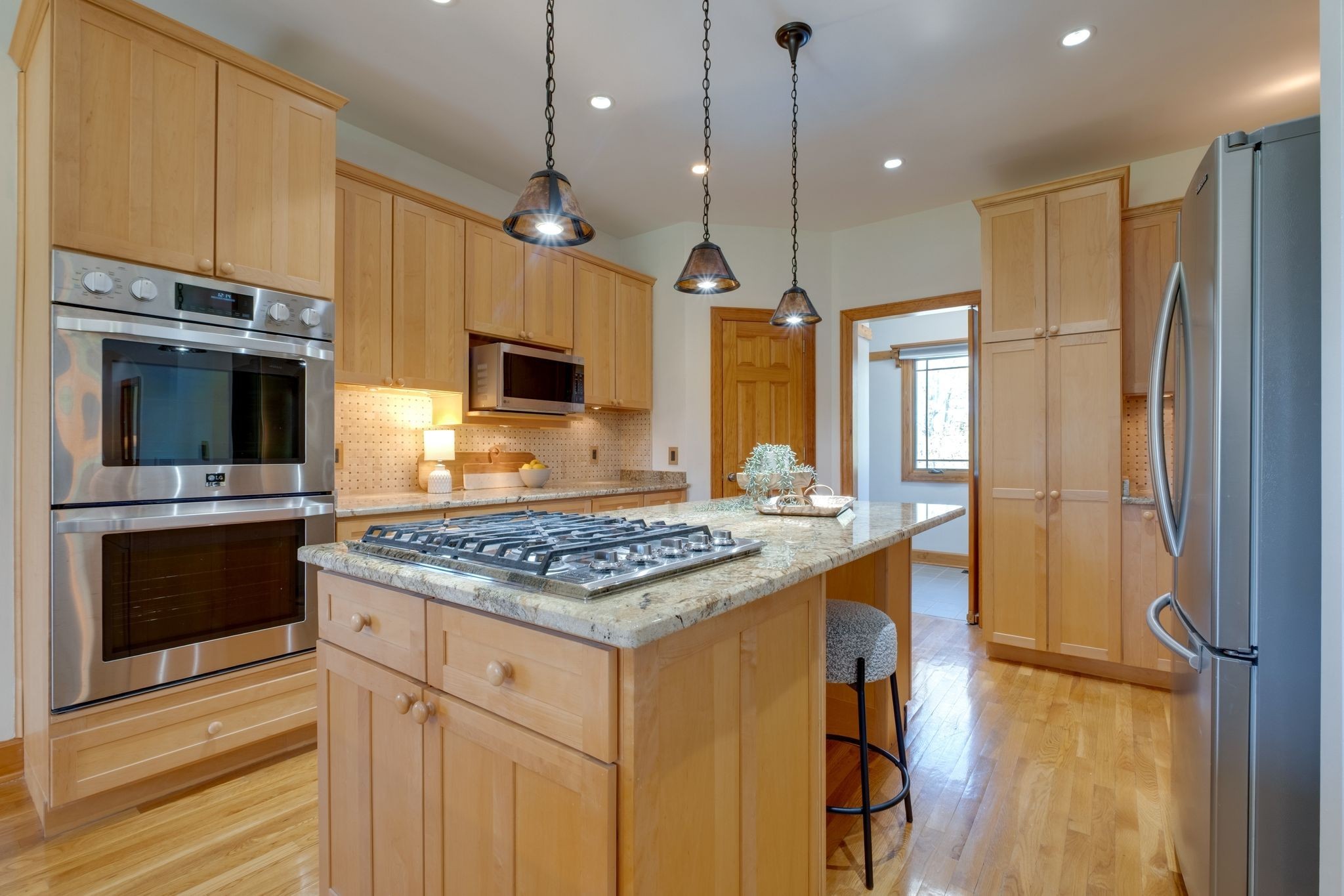 1249 White Road Bon Aqua, TN 37025 - Photo 17 of 60 a kitchen with stainless steel appliances granite countertop a stove refrigerator and microwave