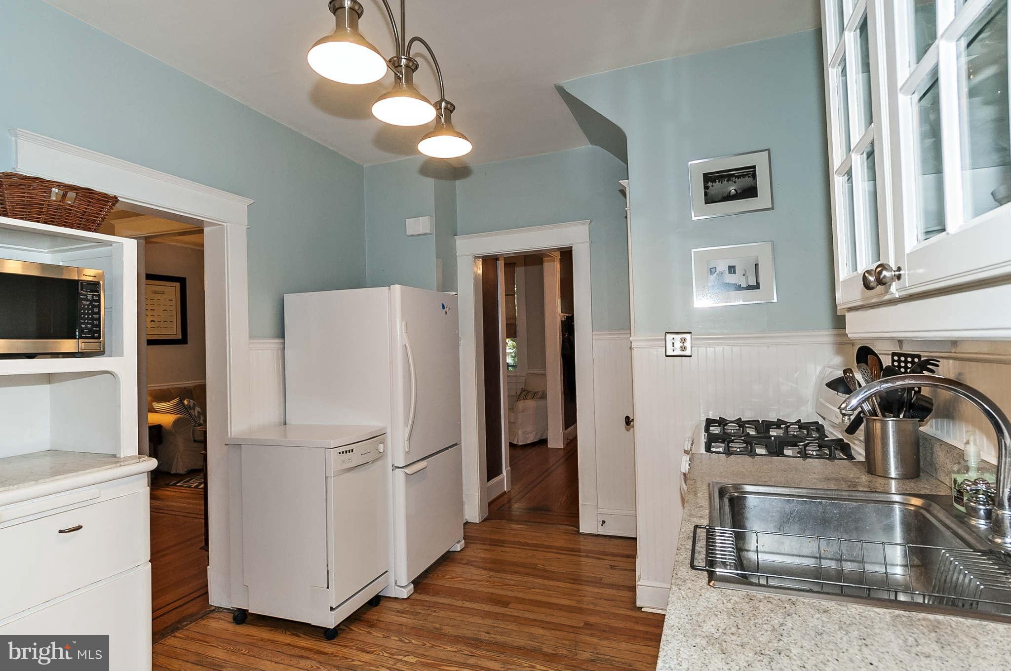 31 Edmondson Ridge Road Baltimore, MD 21228 - Photo 11 of 22 a kitchen with a refrigerator sink and cabinets