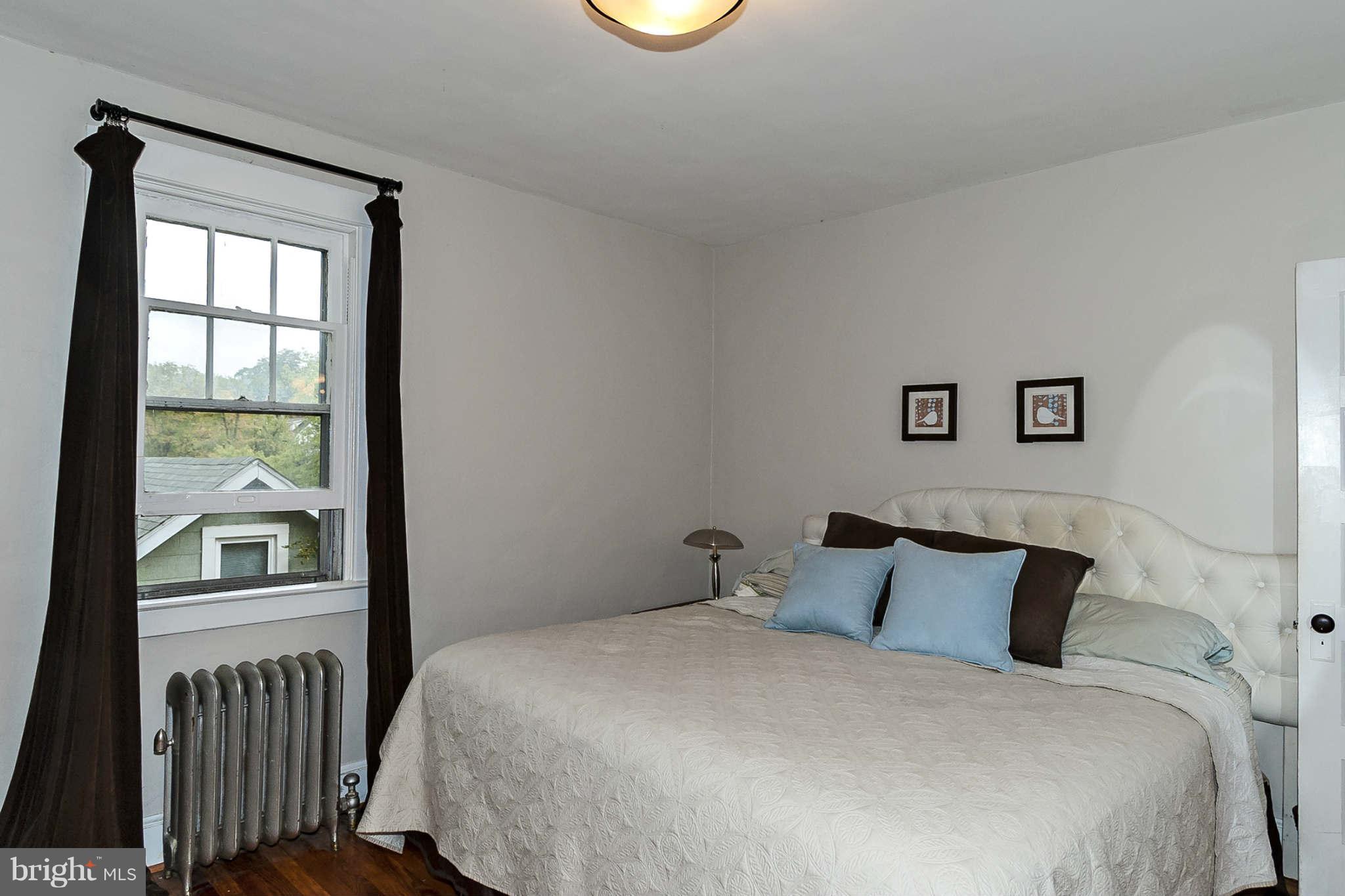 31 Edmondson Ridge Road Baltimore, MD 21228 - Photo 14 of 22 a bedroom with a bed and a window