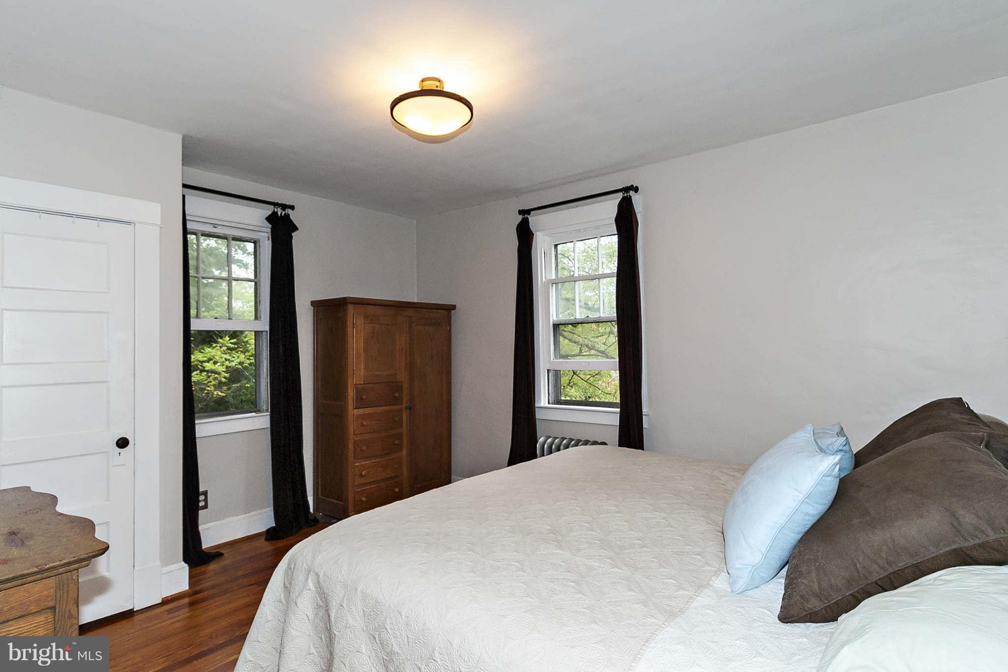 31 Edmondson Ridge Road Baltimore, MD 21228 - Photo 15 of 22 a bedroom with a bed and wooden floor