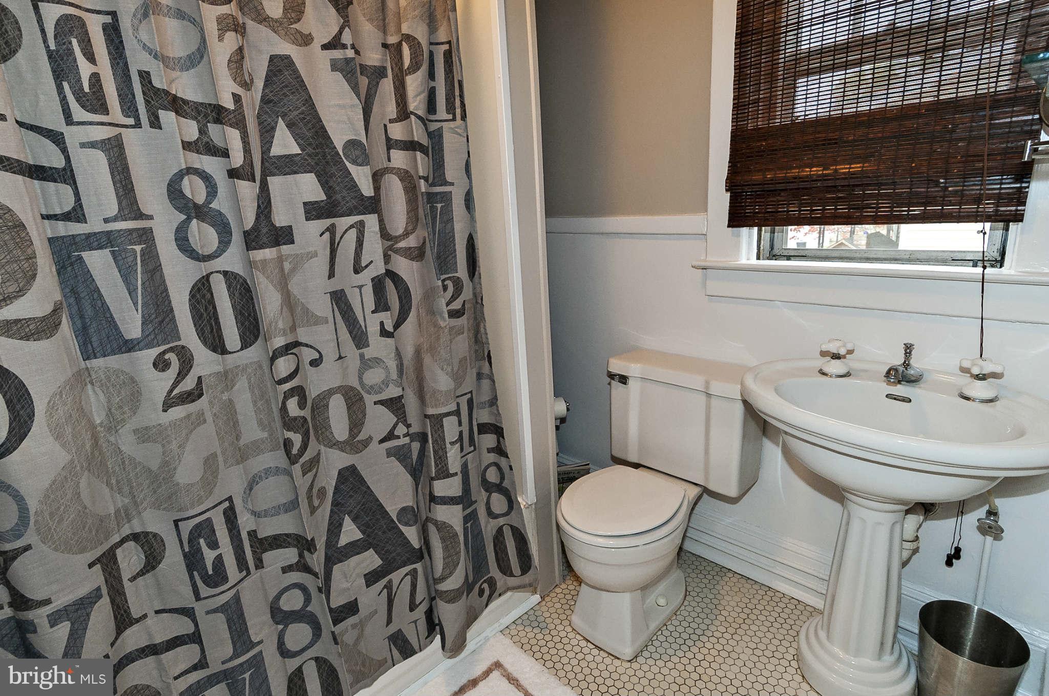 31 Edmondson Ridge Road Baltimore, MD 21228 - Photo 18 of 22 a bathroom with a sink and toilet