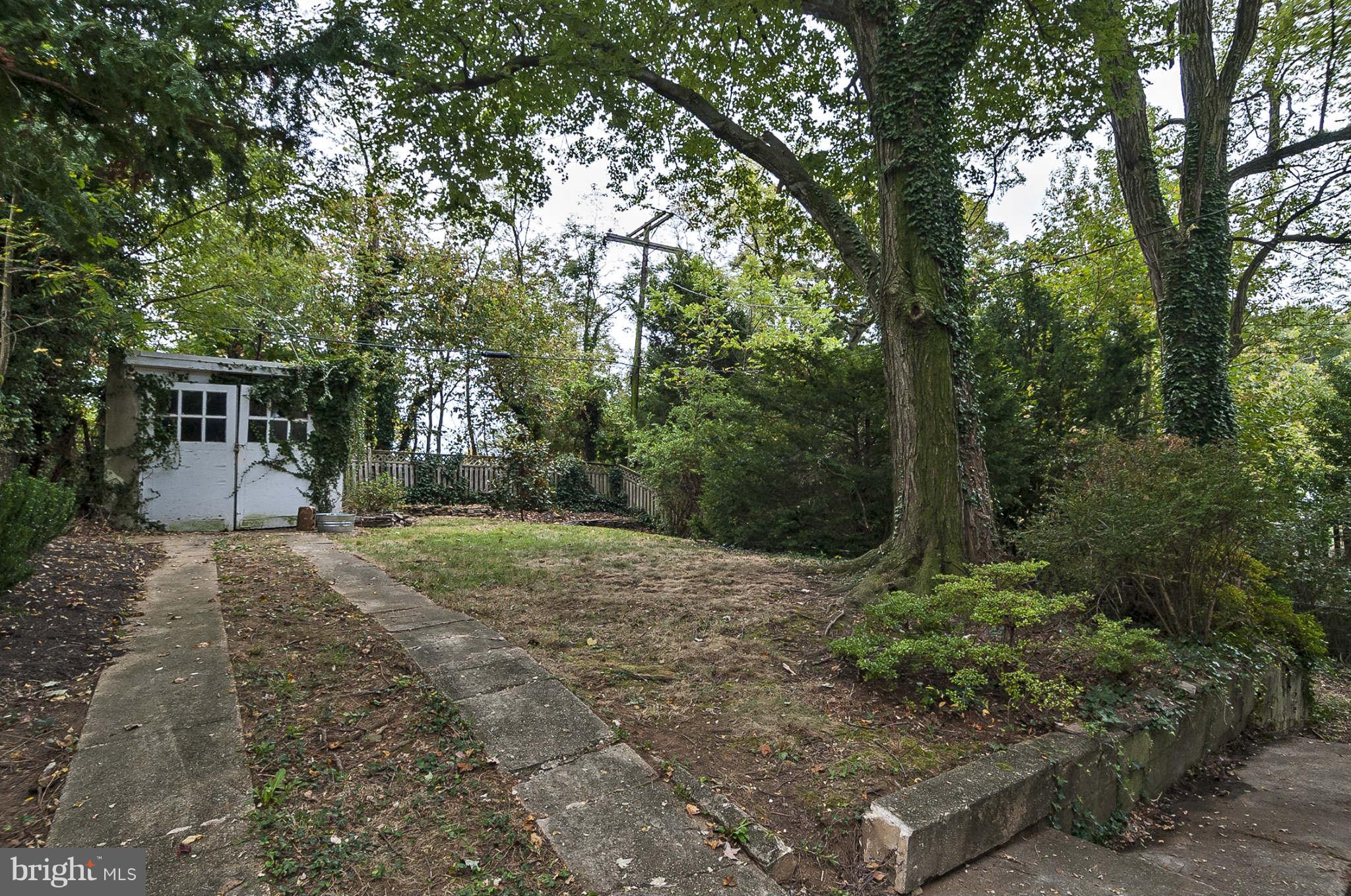 31 Edmondson Ridge Road Baltimore, MD 21228 - Photo 20 of 22 a view of a yard with plants and trees
