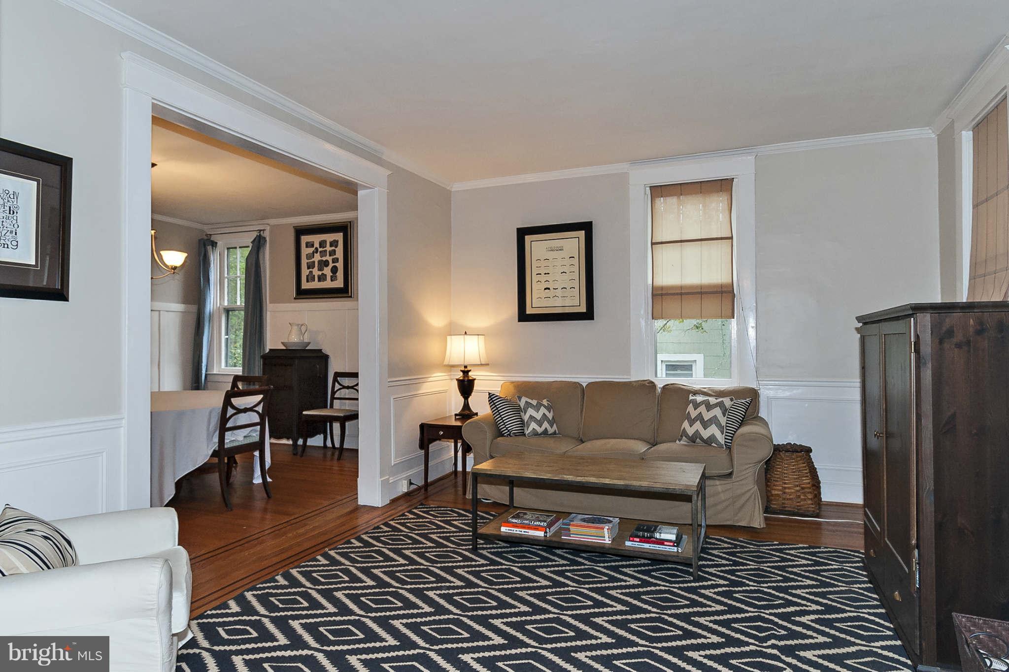 31 Edmondson Ridge Road Baltimore, MD 21228 - Photo 6 of 22 a living room with furniture a large window and a table