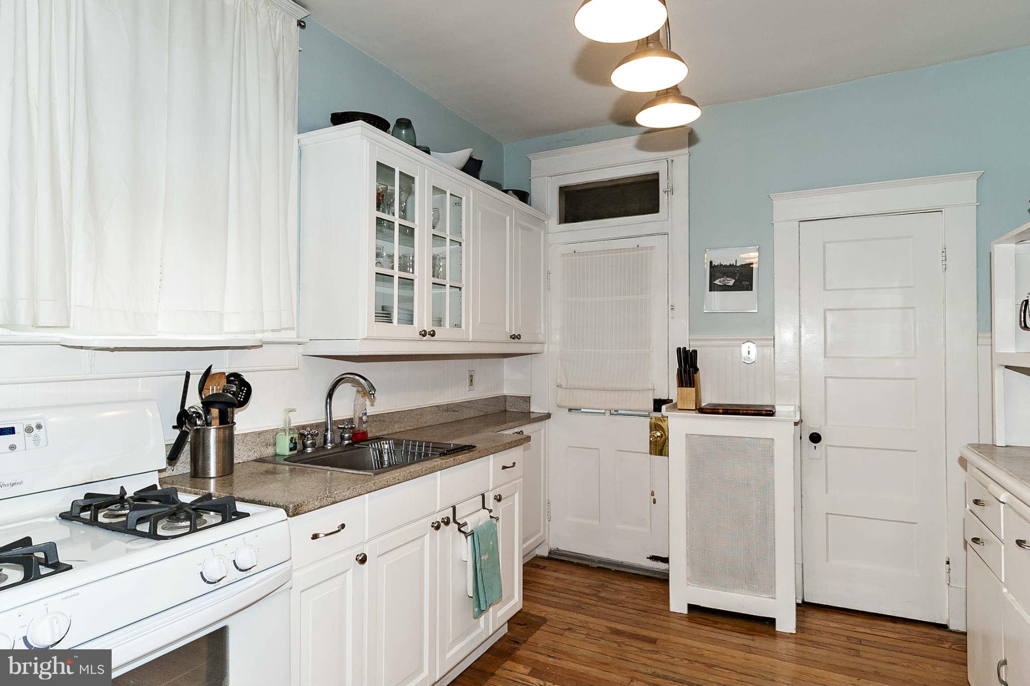 31 Edmondson Ridge Road Baltimore, MD 21228 - Photo 10 of 22 a kitchen with stainless steel appliances a sink stove and cabinets