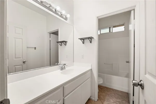 a bathroom with a sink a mirror and a bathtub