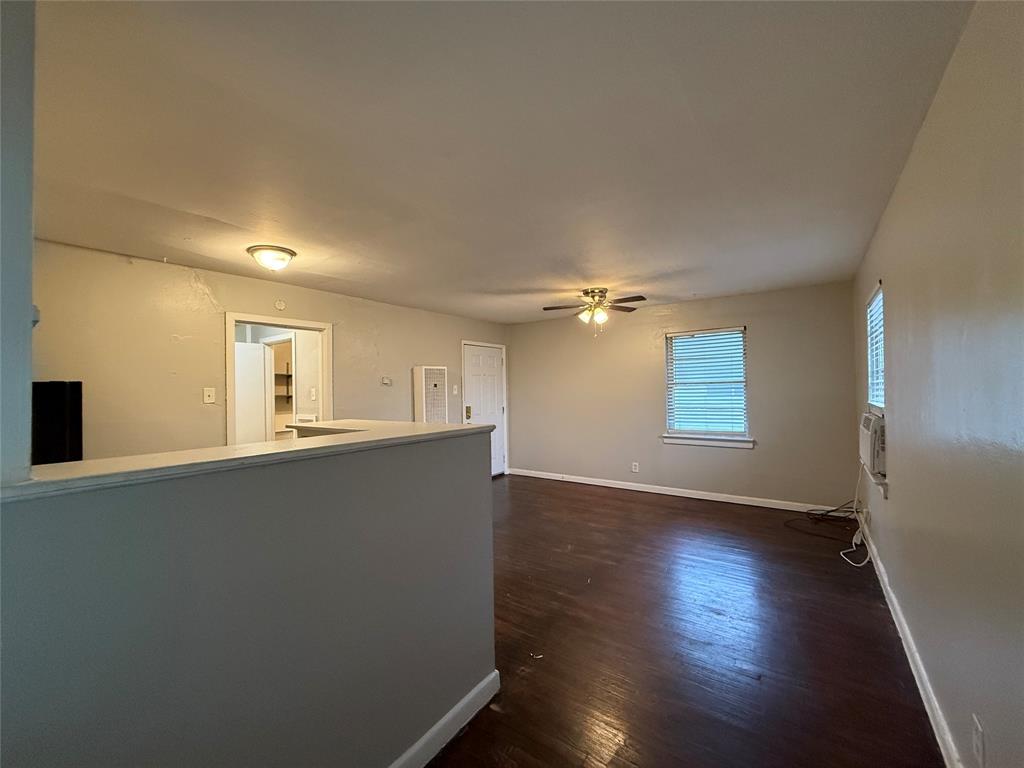 4815 Live Oak Street, Unit 10 Dallas, TX 75204 - Photo 13 of 13 Unfurnished room with dark wood-type flooring and a ceiling fan