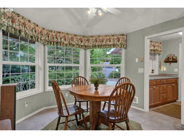 a view of a dining room with furniture window and outside view
