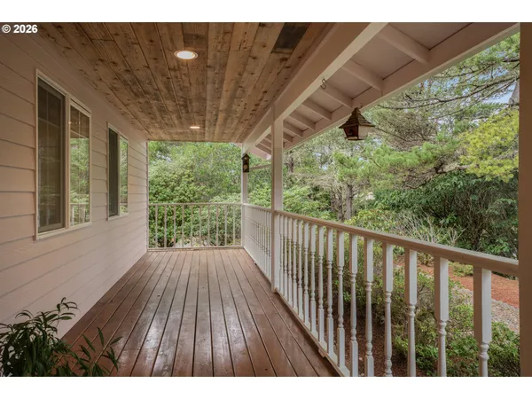 a view of balcony with wooden floor
