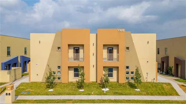 an empty room with closet and a ceiling fan