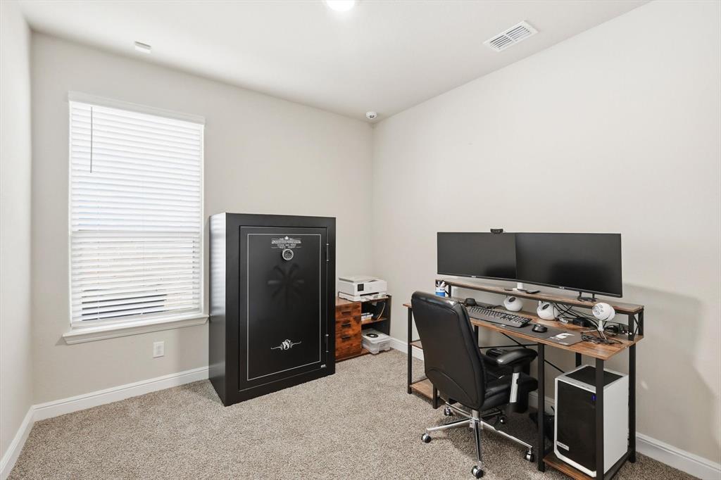 317 Hogan Drive Denton, TX 76210 - Photo 23 of 30 a view of a workspace with furniture and a window