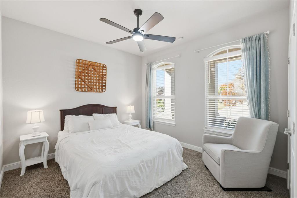 317 Hogan Drive Denton, TX 76210 - Photo 24 of 30 a bedroom with a large bed and a window