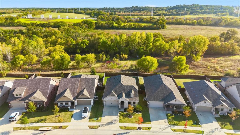 317 Hogan Drive Denton, TX 76210 - Photo 4 of 30 a view of an ocean from a mountain