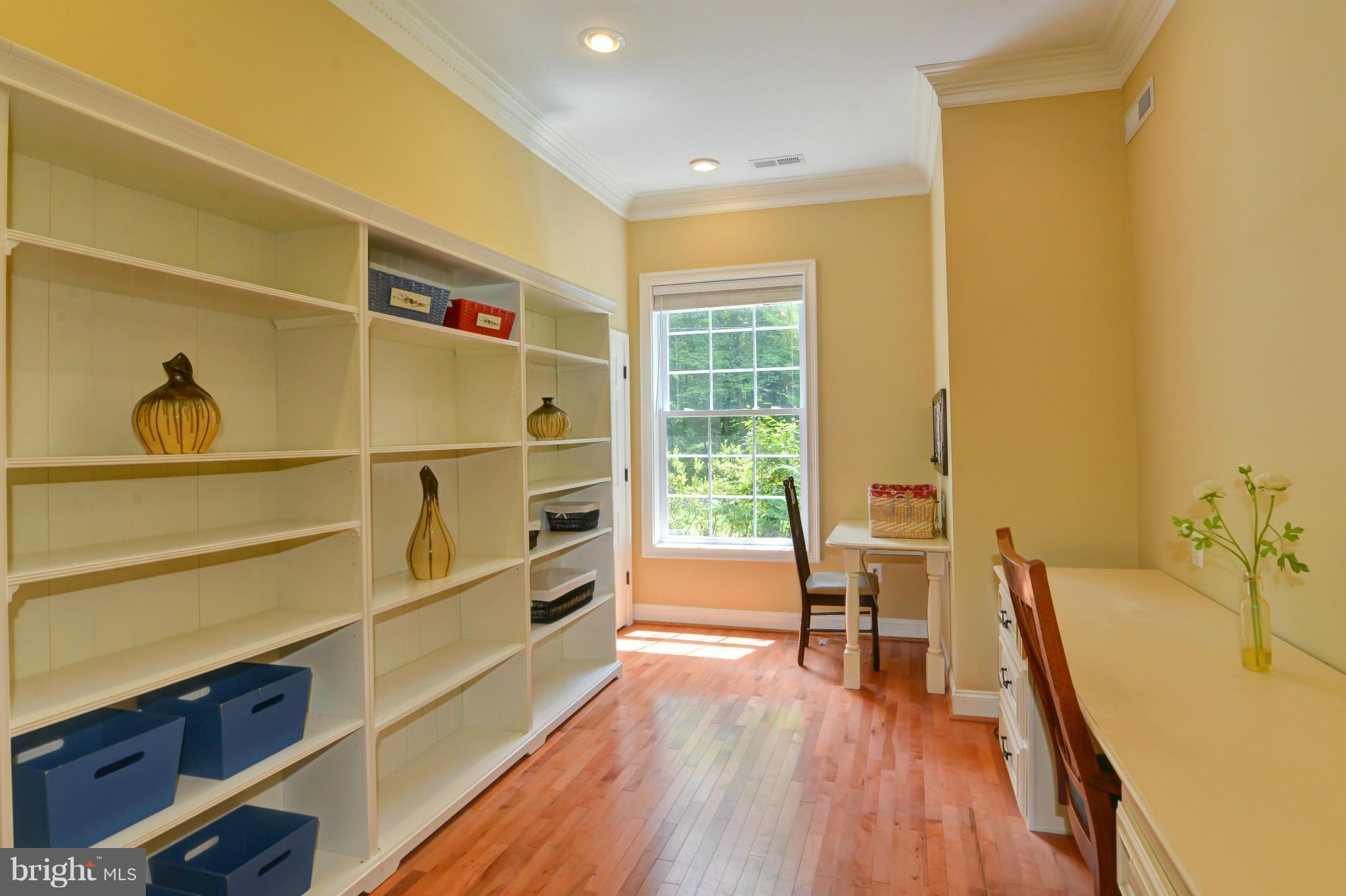 8130 Stacey Road Alexandria, VA 22308 - Photo 14 of 30 a view of a living room with furniture and wooden floor