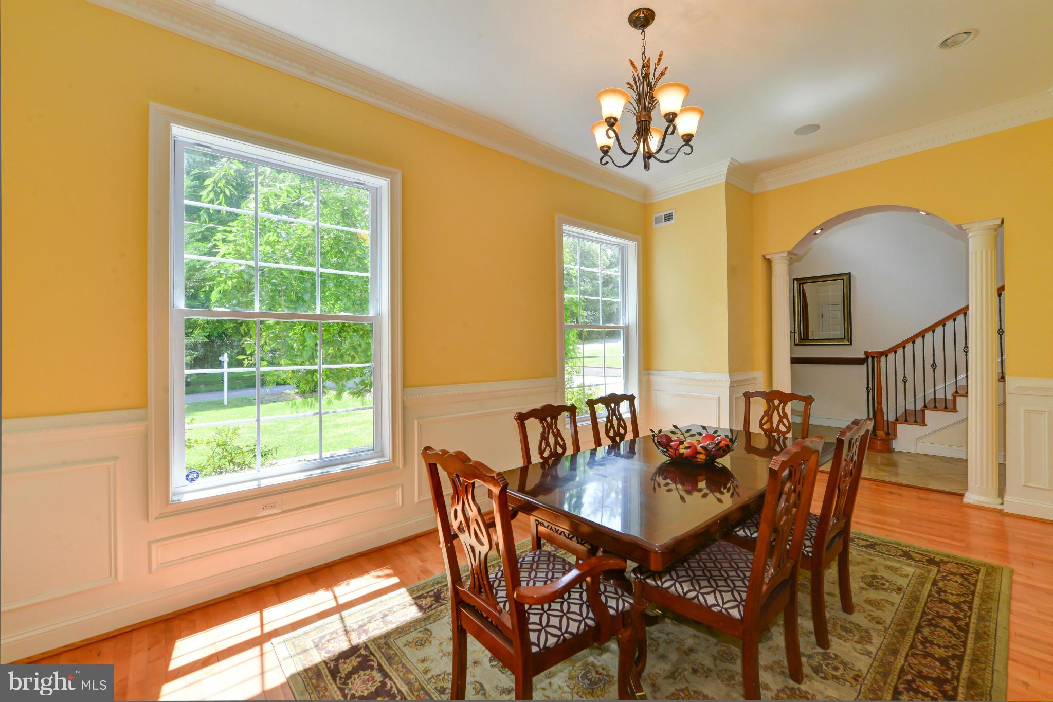 8130 Stacey Road Alexandria, VA 22308 - Photo 4 of 30 a view of a dining room with furniture and a chandelier