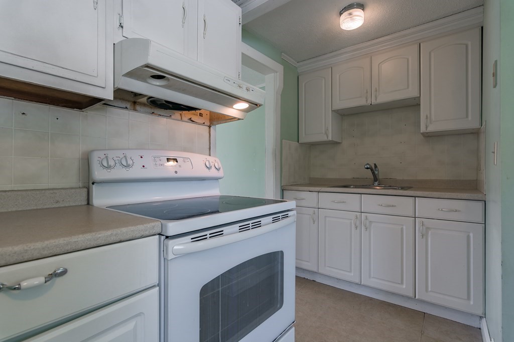 139 Baldwin Street Lowell, MA 01851 - Photo 16 of 39 a utility room with dryer and washer